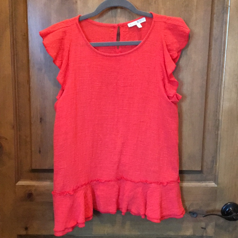 Cute peplum with ruffles top.